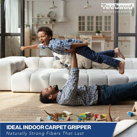 Father lifting son on a couch, promoting safety with Non Slip Rug Pad 4 By 6 Foot Reversible Gripper For Hardwood Vinyl Tile And Laminate Floors.