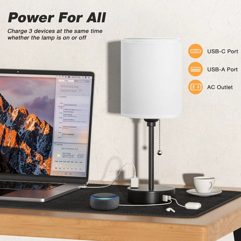 Bedside Table Lamp With 3 Color Temperatures And USB C And USB A Ports, Pull Chain, Built In AC Outlet, on desk with laptop