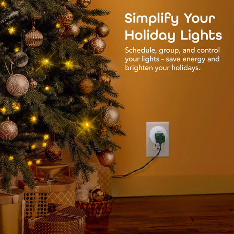 Dot Smart Plug With 2.4GHz WiFi in outlet, controlling holiday lights by Christmas tree, voice control with Alexa and Google Assistant.