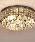 Close-up of 4 Light Traditional Crystal Chandelier In Bronze Drum Ceiling Light Fixture With Round Metal Shade And Raindrop Crystals