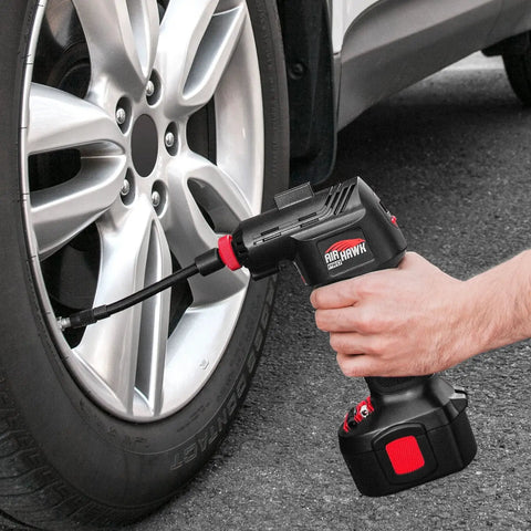 Cordless Tire Inflator With Digital Gauge And LED Light inflating car tire, showing flexible 5 inch hose and nozzle.