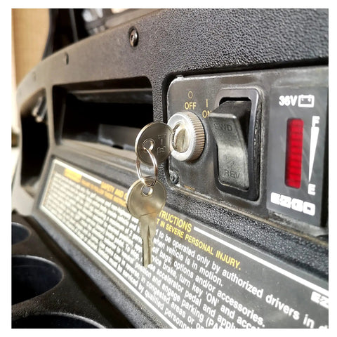 Universal EZGO Golf Cart Ignition Key Switch Starter With 2 Terminal Prongs installed on dashboard with keys