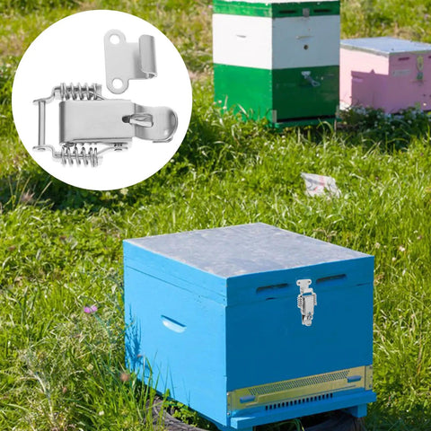 Beefy Stainless Steel Spring Toggle Latch With Lock Hole Heavy Duty Toolbox Draw Latch Clamp on blue beehive in field.