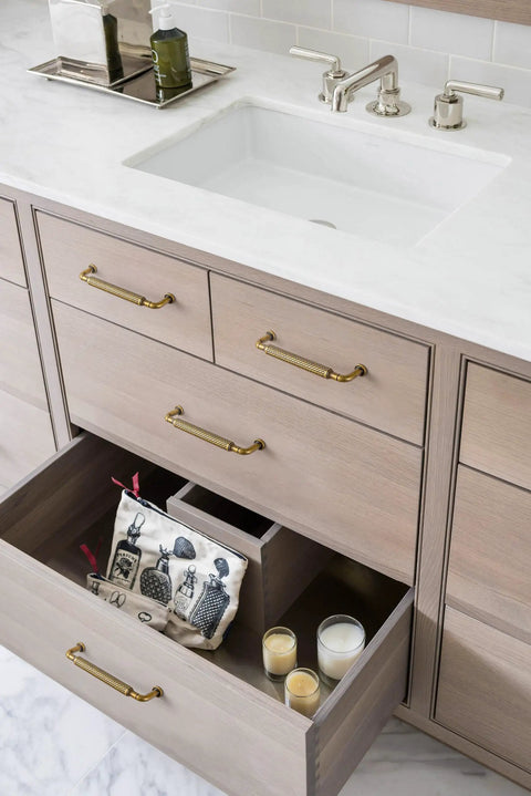 Vanity with open drawer showing Antique Brass Cabinet Pulls Set, Solid Zinc Alloy Drawer Handles, 3.8 Inch Center, 6 Pack.