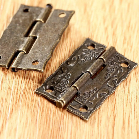 Close-up of 2 Pack Cabinet Door Hinges 36x23mm Wooden Box Decorative Hinges With Screws And Storage Box on wood surface.