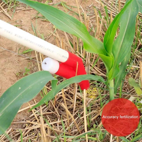 Manual Seed And Fertilizer Spreader With Comfortable Shoulder Strap And Ergonomic Handle For Farm Garden And Vegetables No Mess Easy To Use Bag Included Now in action, fertilizing corn plant.