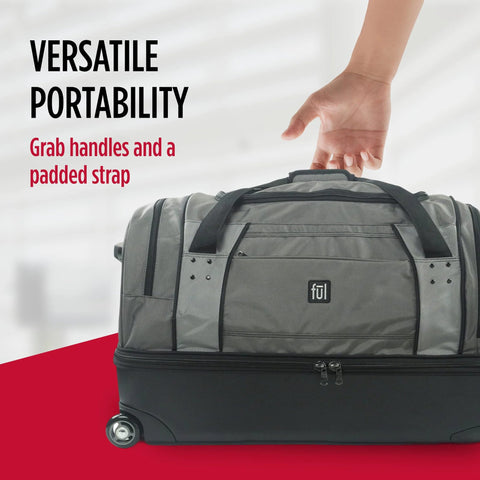 Hand holding rolling duffel bag with split storage and padded strap, showcasing versatile portability. Ful gray duffel with hard shell base.