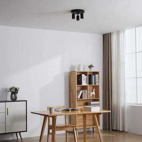Shura Round 3-Light Black LED Ceiling Light With Rotatable Heads, Adjustable Flush Mount, in a modern living room setting