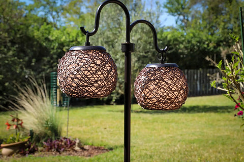 Castillo Outdoor Table Lamp In Oil Rubbed Bronze With Woven Rattan Shades, Rustic Two-Light 29 Inch Patio Lamp in garden setting