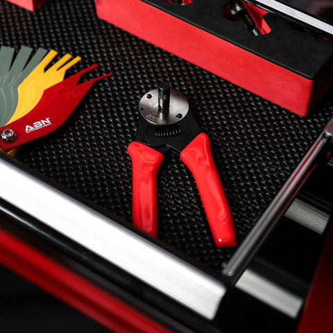 Deutsch Closed-Barrel D-Sub Crimper for 12-20 AWG with Ratcheting Action on black textured tray with red handles