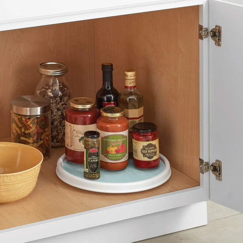 12 Inch Lazy Susan Turntable Organizer Featuring Slick Spinning Heavy Duty Ball Bearings And Nonskid Base in kitchen cabinet with jars.
