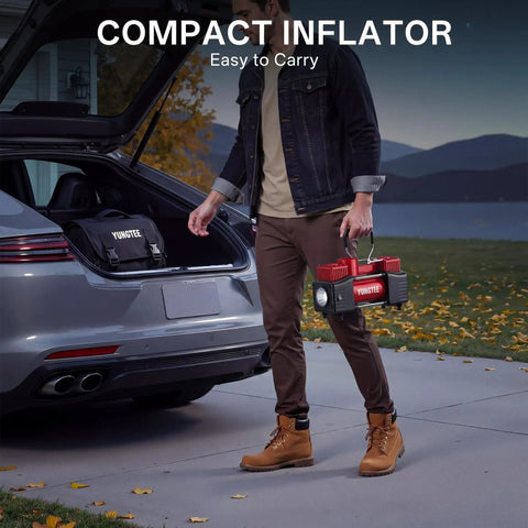 Man carrying Beefy 12V Double Cylinder Tire Inflator with car trunk open, showcasing easy portability for road use.
