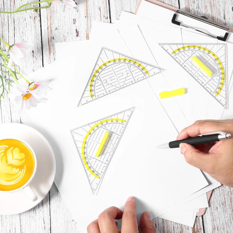 Four Piece Transparent Triangle Ruler Set With Protractor And Set Squares For Drafting And Geometry Drawing A Handy Multifunction Tool Kit For Designers Architects Engineers And Students. Transparent plastic rulers on paper