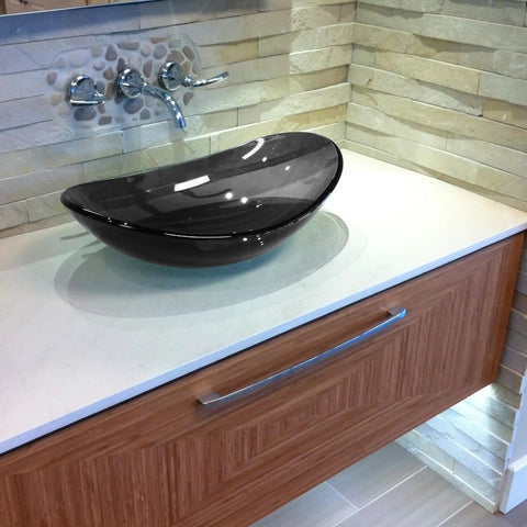 Clear Grey Bigio Glass Vessel Bathroom Sink With Above Counter Mount Tempered Glass Scratch Resistant And Non Porous 21.5 By 15 By 5.5 Inches Drain Opening 1.75 Inches Modern Vessel Design on countertop.