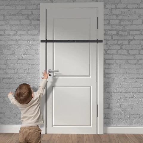 Badass Heavy Duty Door Security Bar Set Rock Solid Adjustable Barricade Bracket protecting a door with a child reaching for it.