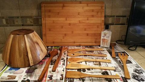 Butcher Block And Cutting Board Oil 12 Oz Pack Of 3 Colorless Odorless Tasteless Food Safe With Vitamin E FDA Approved displayed with wooden utensils and bowl.