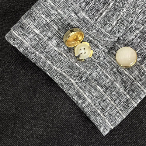 Copper Button Covers For Travel And Formal Wear Snap On Cufflink Style Accessories on a dress shirt cuff.