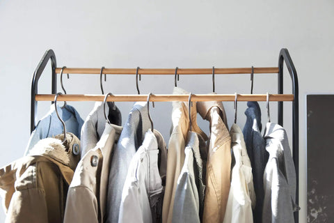 Kickass Rolling Wardrobe Rack With Staggered Wooden Bars And Roomy Bottom Shelf Built Tough With Steel Frames Delivers The Ultimate Flex For Portable Closet Setup Anywhere Glides On Smooth Casters with hanging jackets.