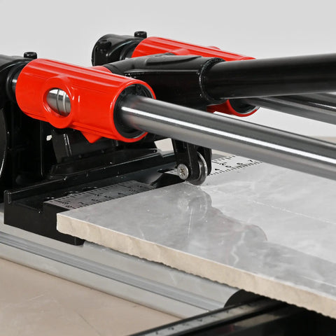 Beefy 24 Inch Manual Tile Cutter Featuring Slick Double Rail Guide System And Wide Aluminum Base Heavy Duty Hand Tool for cutting ceramic and porcelain floors fast, showing red handle and steel guide rails.