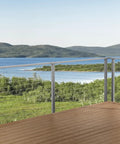 Complete 30 Ft Cable Railing Kit For Decks And Patios With Marine Grade Stainless Steel Wire installed on a scenic deck overlooking water.