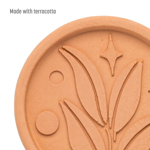 Terracotta Brown Sugar Saver Disc with elegant leaf design, food-safe softener for hard brown sugar, shown up close.