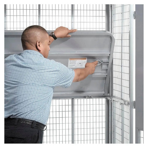 Man adjusting the lockable wire mesh cage on the Heavy Duty Folding Security Truck With Lockable Wire Mesh Cage.