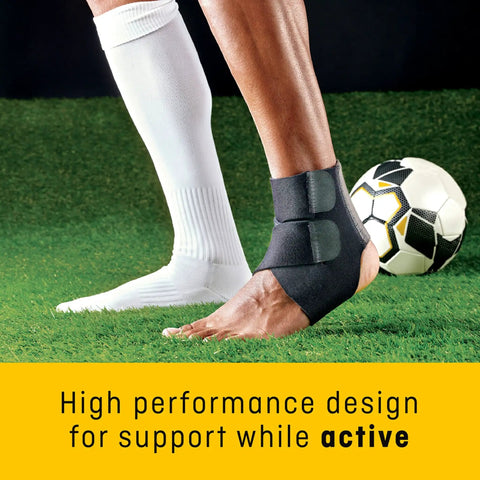 Close-up of a person wearing Performance Ankle Support With Adjustable Straps For Moderate Compression Arch Lift playing soccer.