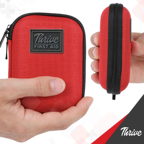 Thrive Mini First Aid Kit in red fabric shell with black zipper, front view