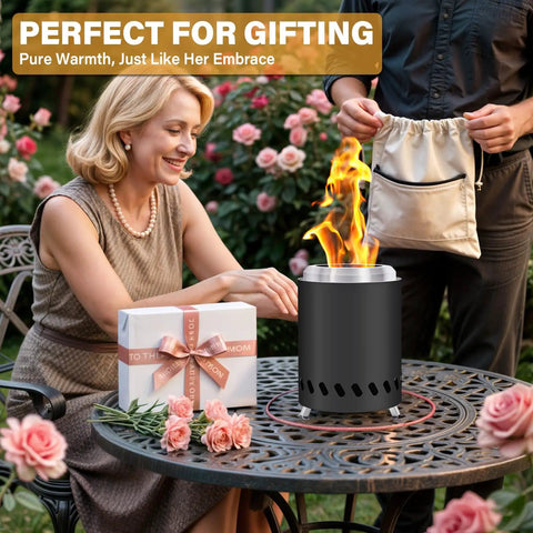 Smokeless Tabletop Fire Pit For Outdoor Use Portable Mini Stove With Carry Bag lit on a table with flowers and gift box