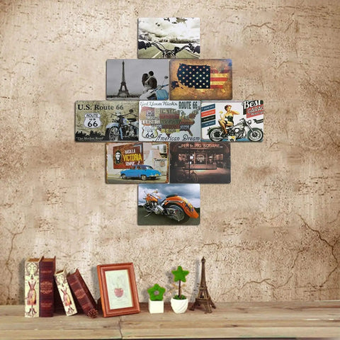 Wall decor with vintage tin signs collage featuring classic cars and motorcycles on a rustic wall with books and ornaments below.