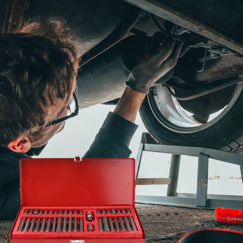 Tough As Nails 40 Piece Hexagon Wrench Socket Set Crafted From Hardened Chrome Vanadium Steel used for auto repairs under a car.
