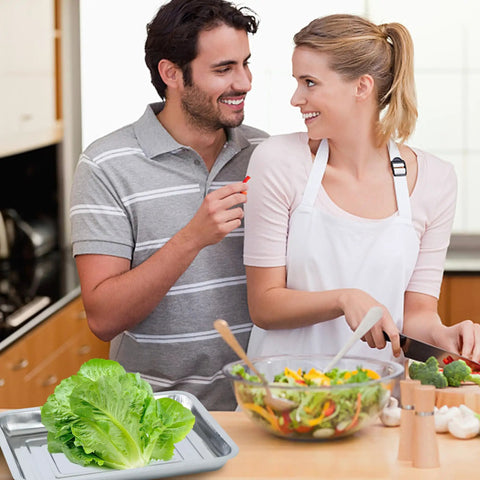Couple in kitchen with salad, Six Pack Stainless Steel Seed Starter Trays For Germination Seedlings And Water Collection visible