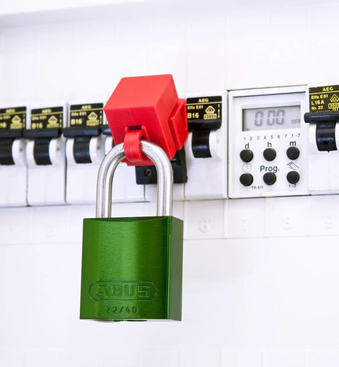 Green 72 40 Lockout Tagout Padlock With 1 Inch Shackle on electrical panel for industrial safety