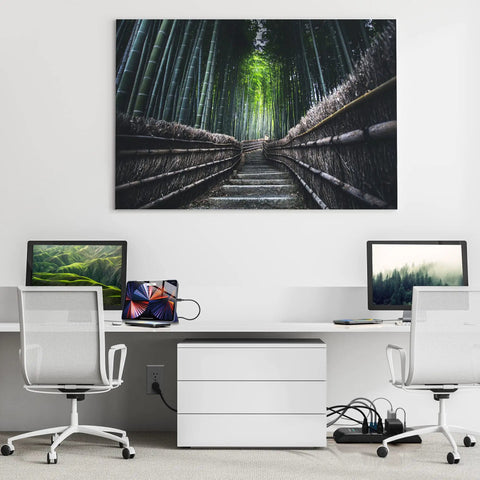 Office setup with laptops, tablet, and Power Surge Protector With 4050 Joules Rating 8 Outlets, USB A/C, coax, ethernet ports under desk.