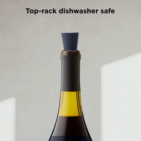 Preserve Your Opened Bottles With This Game Changing Set Of Four Multicolor Wine Stoppers on a wine bottle, showcasing a silicone stopper.