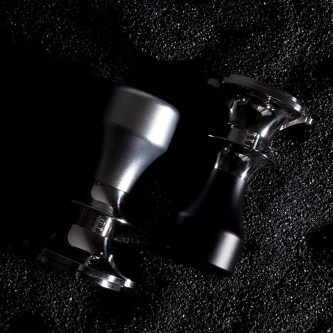 Top Shelf Adjustable Coffee Tamper With Smooth Flat Base Stainless Steel Barista Tool For Your Daily Grind Custom Size Powder Hammer Heavy Duty Kitchen Game Changer Gray, featuring metallic finishes.