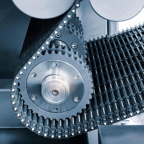 Close-up of machinery showcasing 12 Pack Hollow Shaft Collars With Set Screws One And One Eighth Inch Bore for axle stabilization.