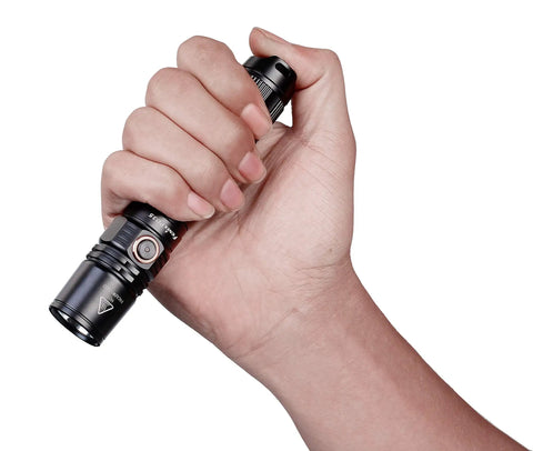 Hand holding PD35 V2.0 Flashlight With Cree XP-L HI V3 LED Up To 1000 Lumens And 250 Meter Throw Tail Switch Tactical EDC Light