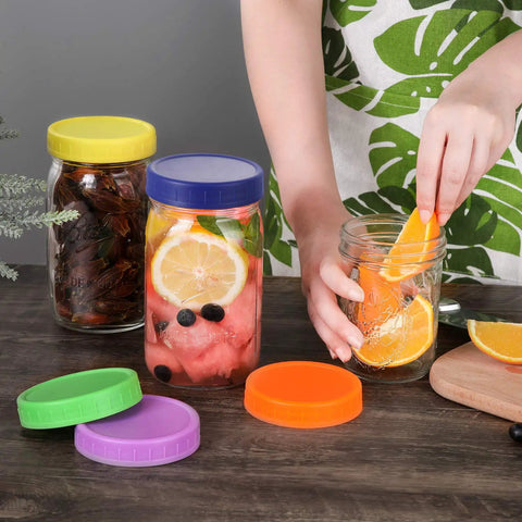Hella Versatile Wide Mouth Mason Jar Lids 16 Pack Dope Colored Plastic Caps For Ball And Kerr Canning Jars Featuring Legit Leak Proof Food Grade Storage Covers That Make Your Pantry Pop with jars of fruits
