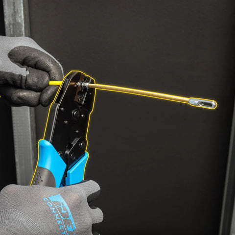 S Class Fish Tape Field Replacement Leader With Fiberglass Construction being crimped by pliers, durable gold pull tape leader