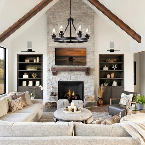 Six Light Farmhouse Wagon Wheel Chandelier Pendant Light Fixture In Matte Black hangs above living room with stone fireplace