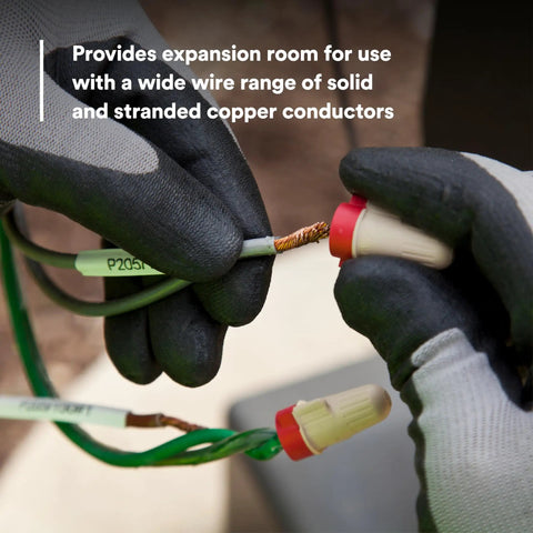 Hands connecting Solid As A Rock Tan And Red Wire Connectors For Twenty Two To Eight Gauge Cables with copper wire.