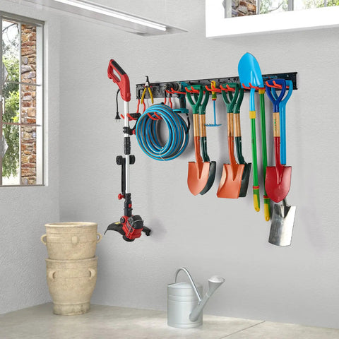 Heavy Duty Multi Storage Garage Hooks Wall Mounted Garden Tool Organizer Featuring Rock Solid Rails For Bikes Rakes Shovels Push Brooms And Outdoor Gear with assorted tools arranged on the wall.