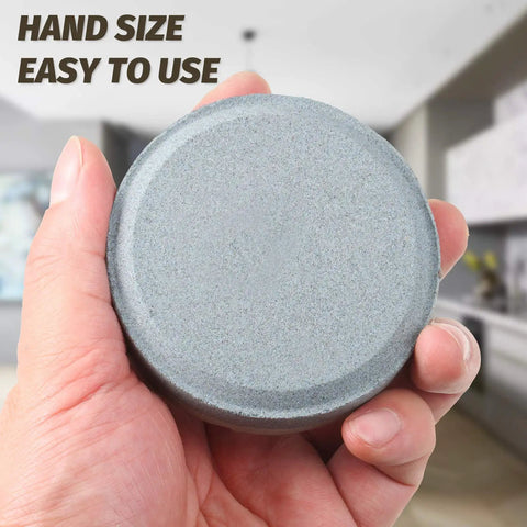 Hand holding hatchet sharpening stone from Axe File Sharpener Set Pro Grade With 120 And 240 Grit Whetstone And 7 Inch Rectangular Axe File