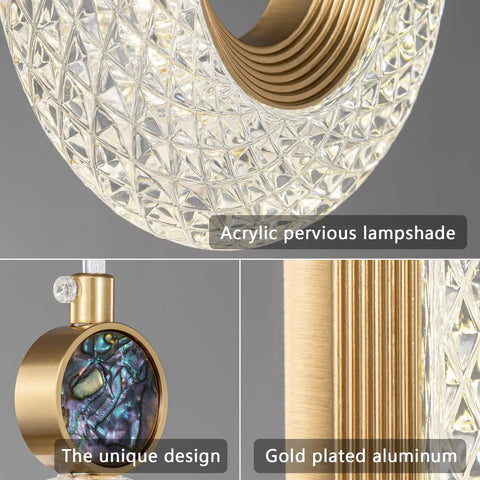 Close-up of Lit Gold Brushed Modern Pendant Lights for Kitchen Island with acrylic lampshade and gold plated aluminum design.