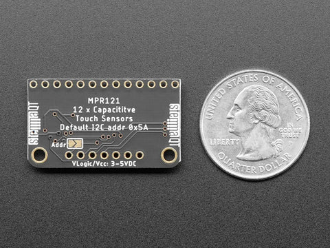 12 Key Capacitive Touch Sensor Breakout Board With MPR121 IC next to a quarter for size comparison.