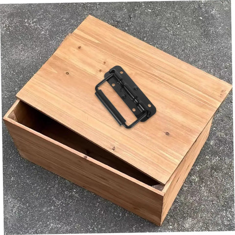 Heavy Duty Stainless Steel Spring Folding Chest Handle For Toolbox Replacement Featuring A Heck Of A Grip And Awesome Quick Setup In Premium Classic Matte Black on wooden chest.