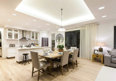 Modern dining room with 4 Inch Square Wafer LED Recessed Downlight With Ultra Thin Trim, Matte White Finish, illuminating space.