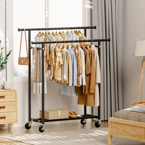 Heavy Duty Rolling Clothes Rack With Double Hanging Bars And Smooth Glide Casters Portable Black Garment Stand For Shirts Pants Jackets in a stylish room.