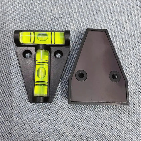Nailed In Position Kick Ass 4 Pack T Level Bubble Spirit Levels for RV Camper Trailer Black Acrylic 2.26x1.72 inches with yellow bubble.